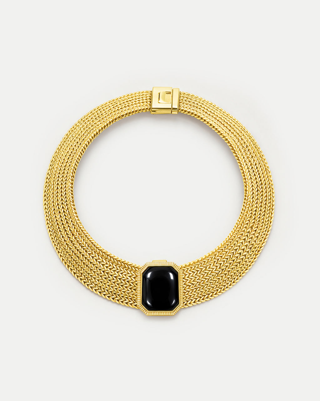 Veronica Beard Gold mesh necklace with black gemstone pendant.