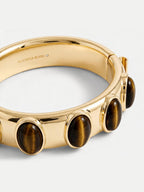 Veronica Beard Gold cuff bracelet with tiger-eye stones.