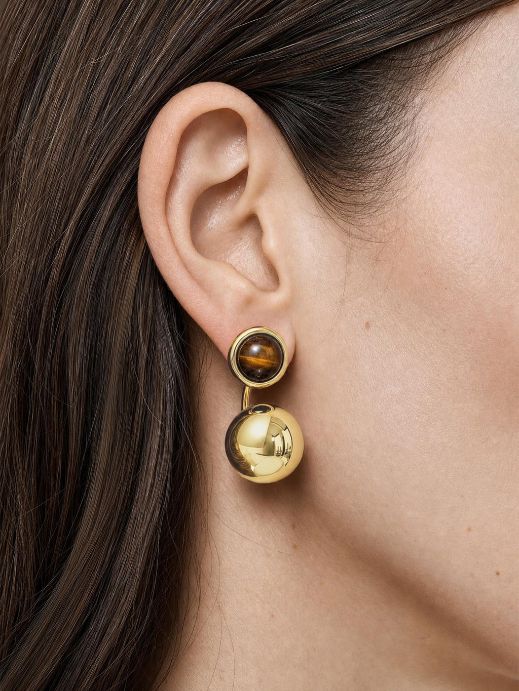 Veronica Beard Gold drop earrings with brown tiger's eye stones.