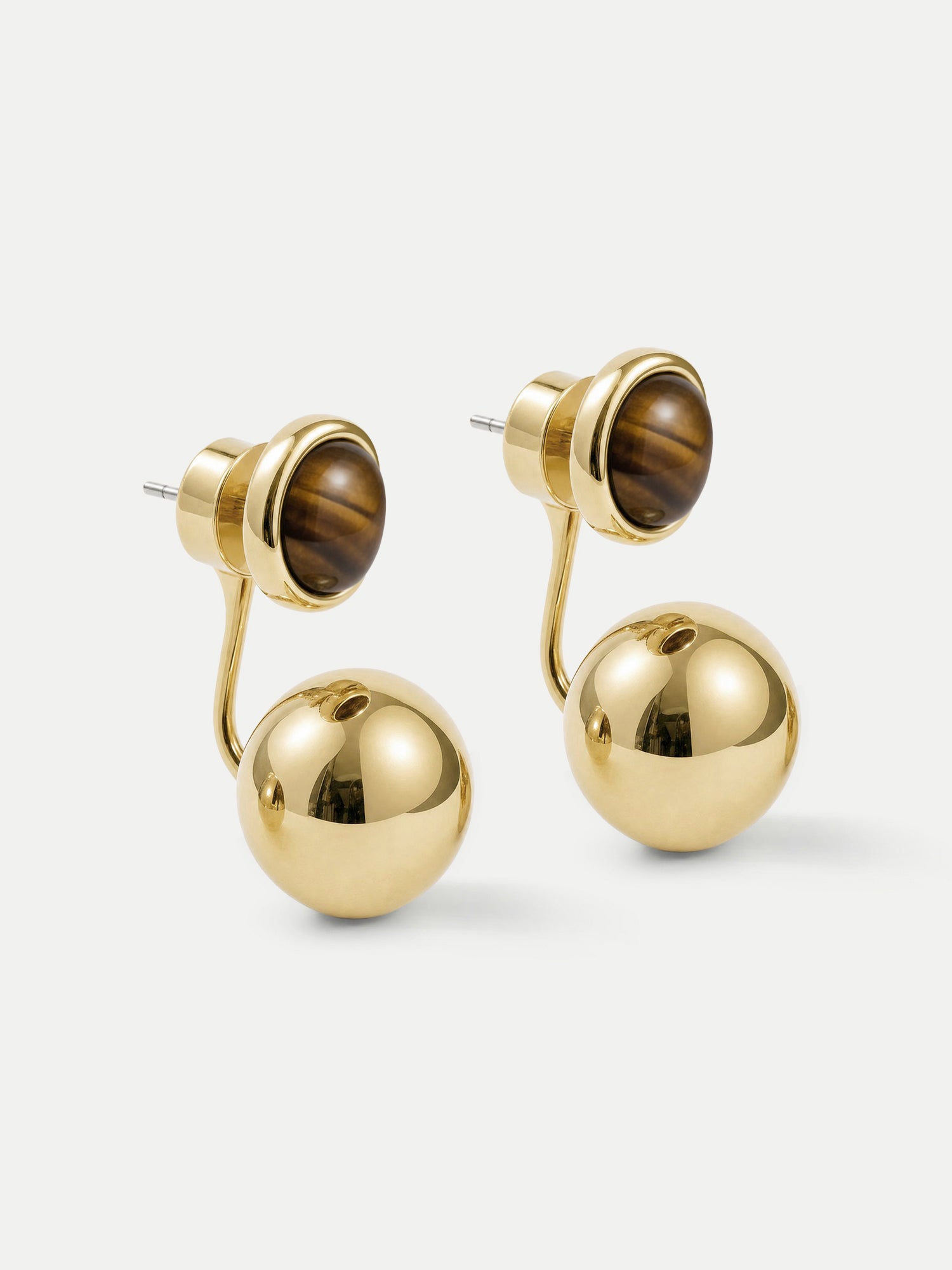 Veronica Beard Gold double-sided ball earrings with brown stones.