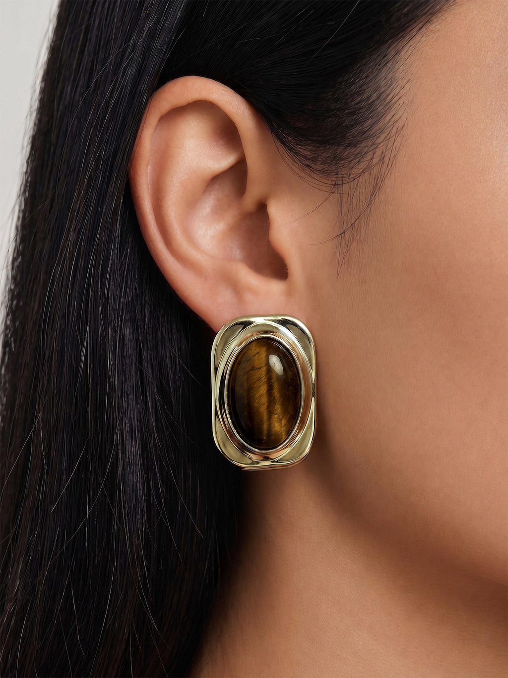 Veronica Beard Gold rectangular earring with brown tiger's eye stone.