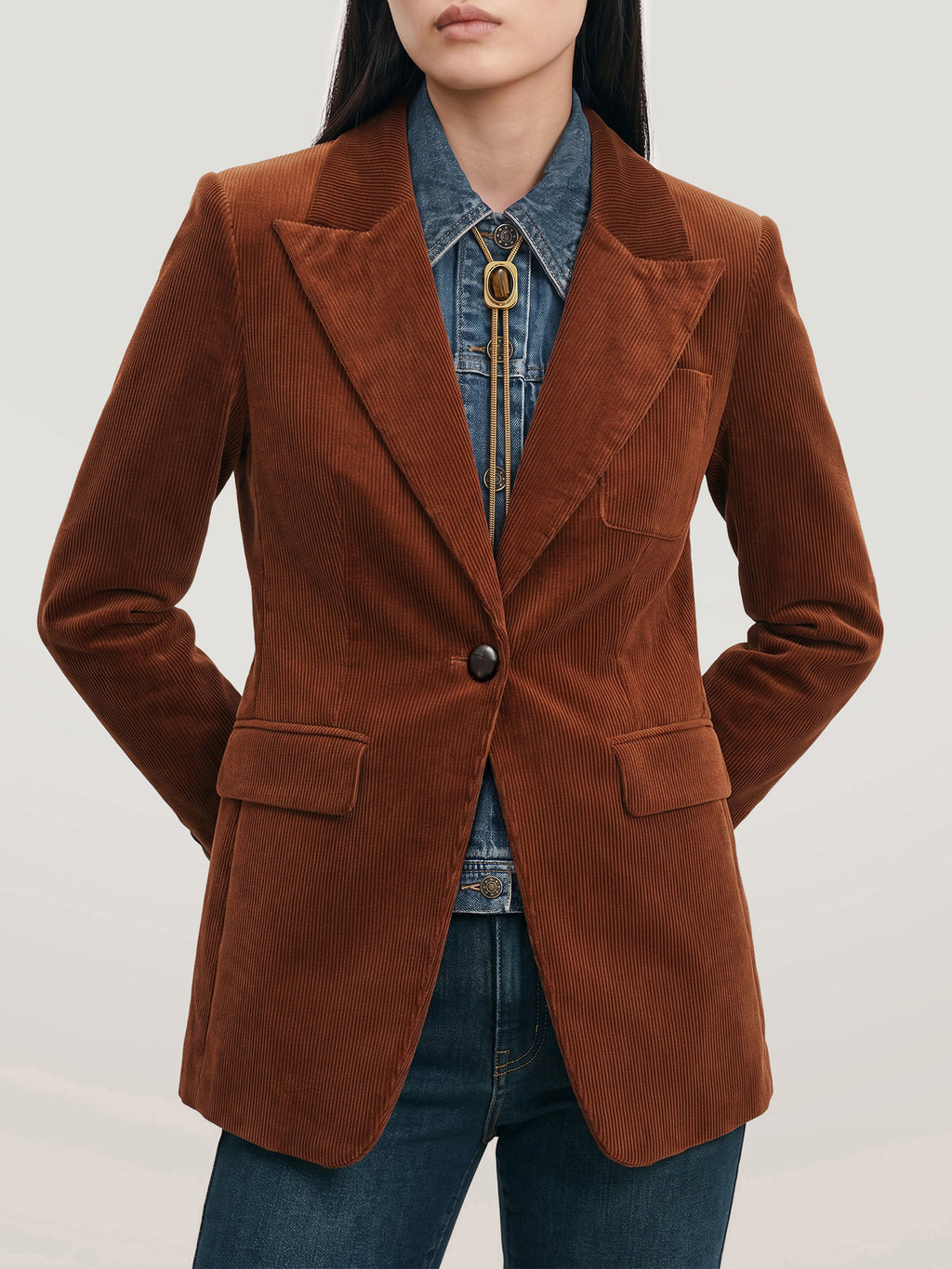 Veronica Beard Brown corduroy blazer with denim shirt and bolo tie.