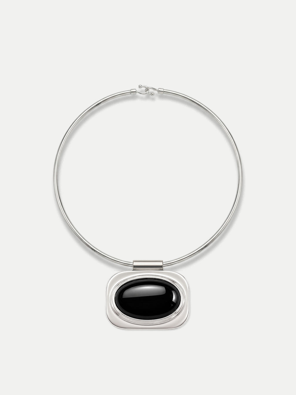 Veronica Beard Silver necklace with black oval pendant.
