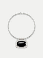 Veronica Beard Silver necklace with black oval pendant.