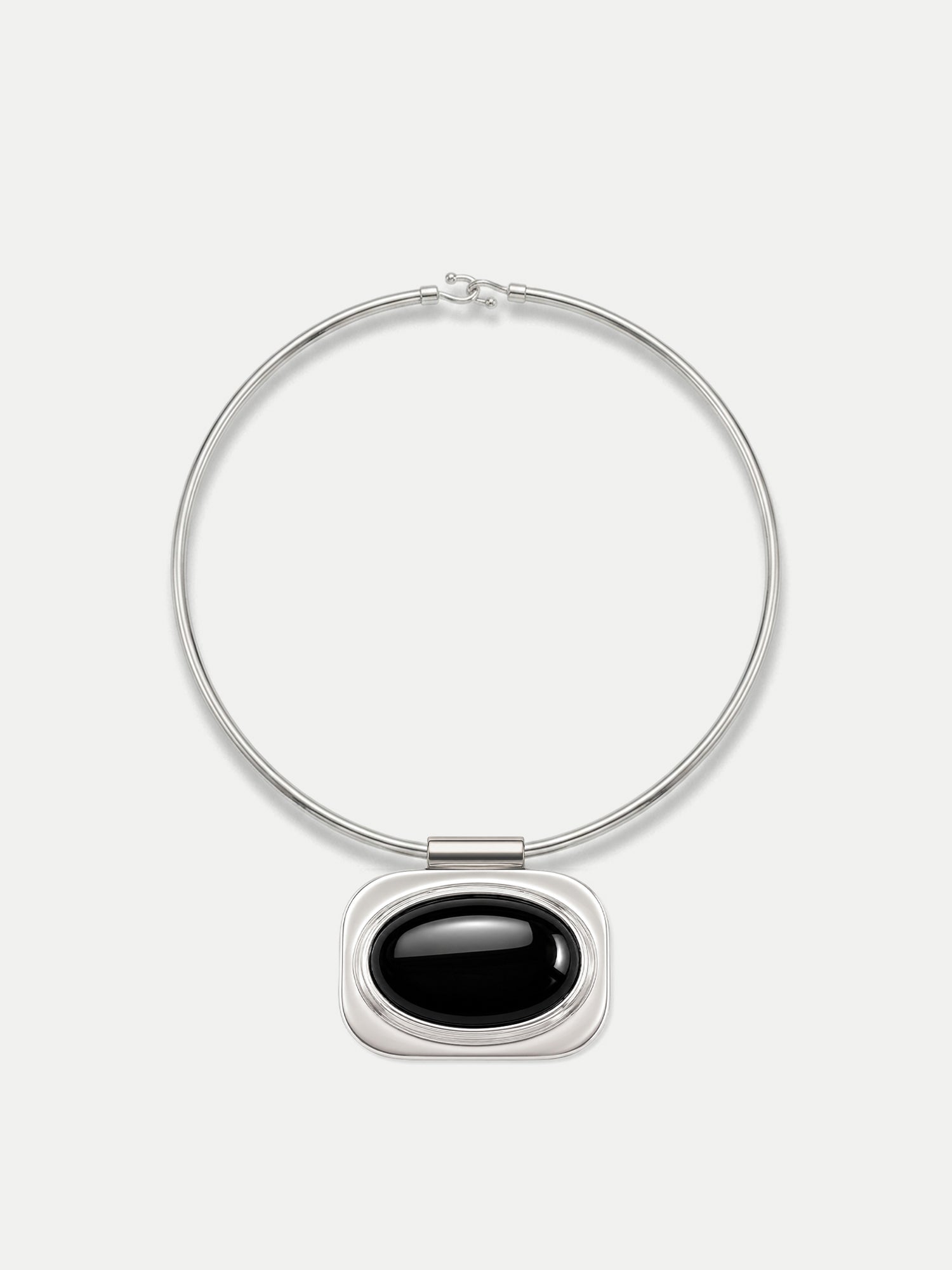 Veronica Beard Silver necklace with black oval pendant.
