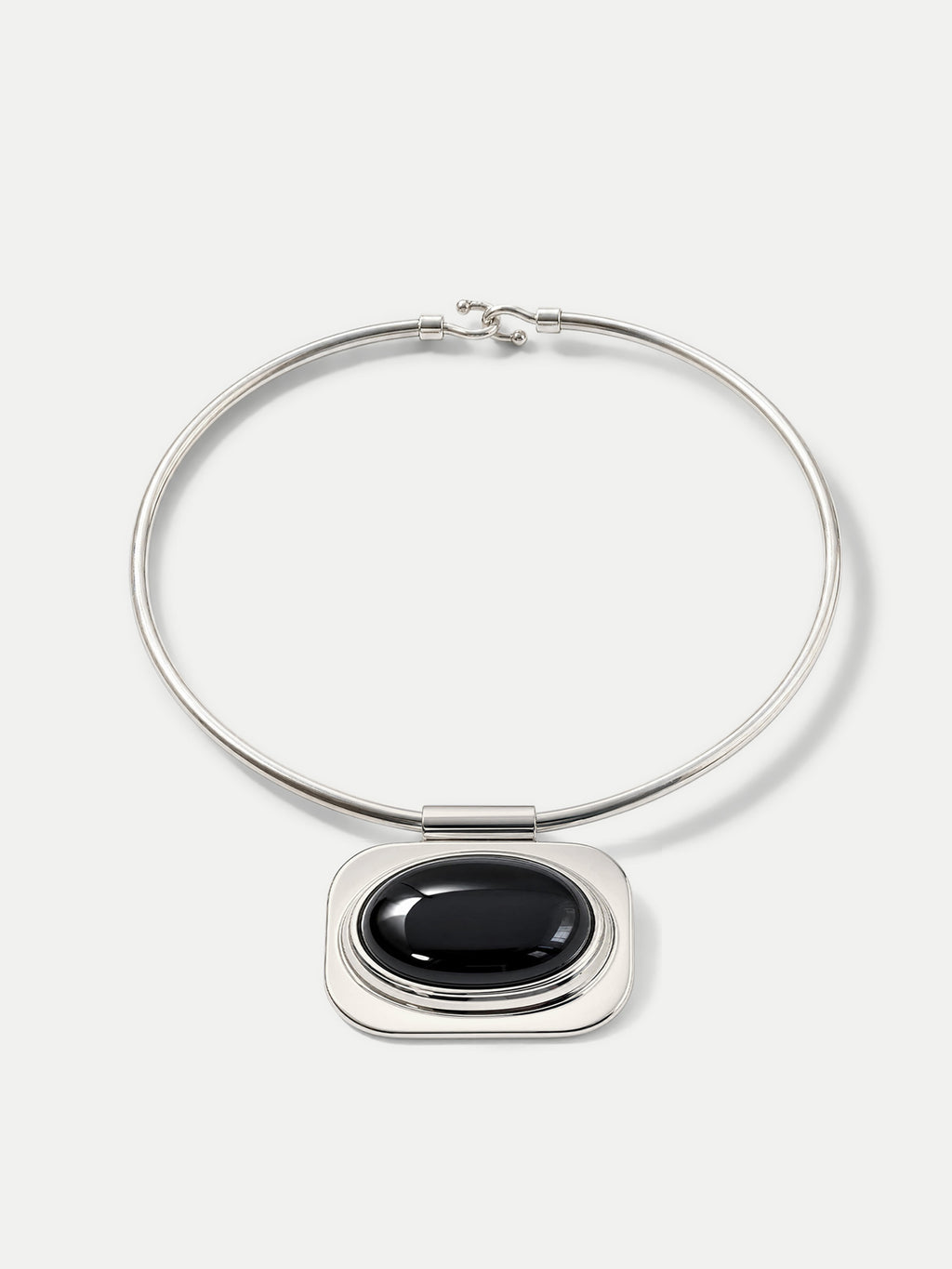 Veronica Beard Silver choker necklace with large black oval pendant.