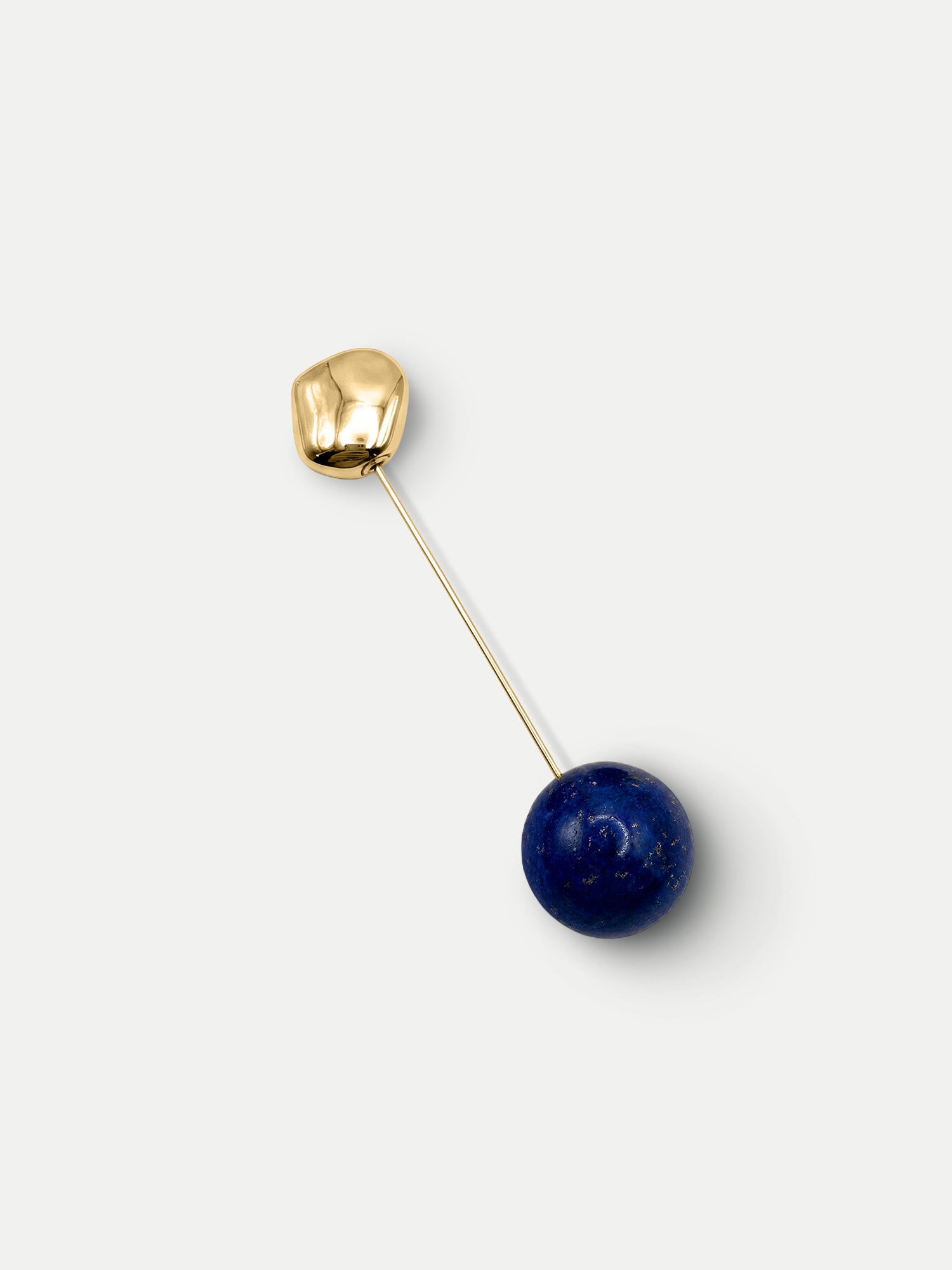 Veronica Beard Gold and blue lapis lazuli bead pin.
