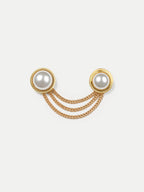 Veronica Beard Gold triple chain brooch with two white pearls.