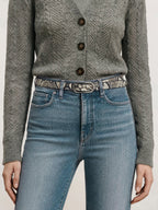 Veronica Beard Gray cable knit cardigan, blue jeans, snakeskin belt.