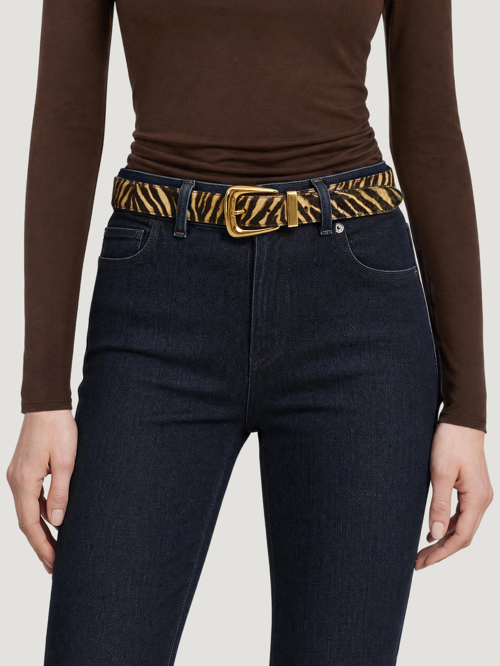 Veronica Beard Zebra print calf hair belt with gold buckle.