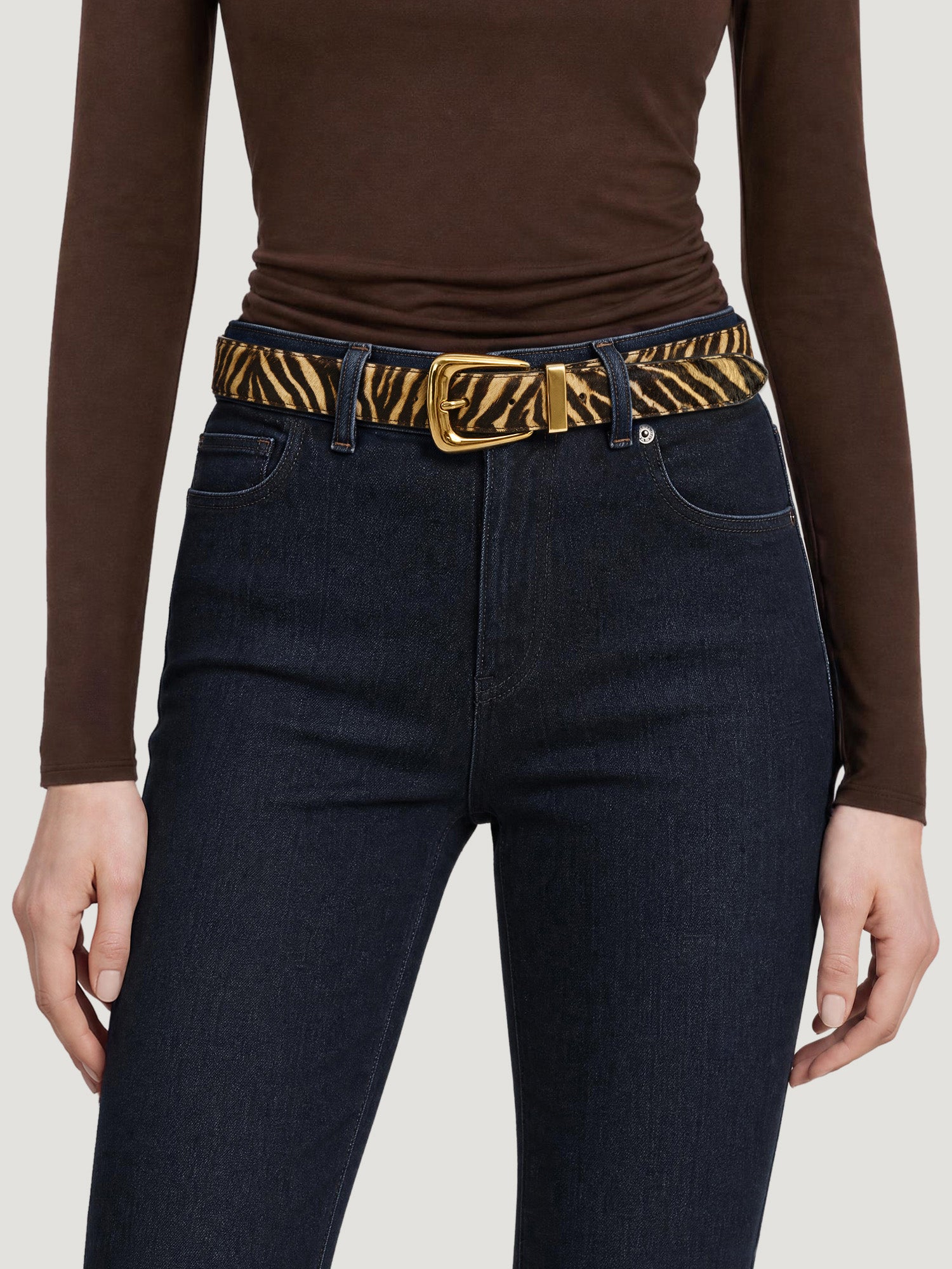 Veronica Beard Zebra print calf hair belt with gold buckle.