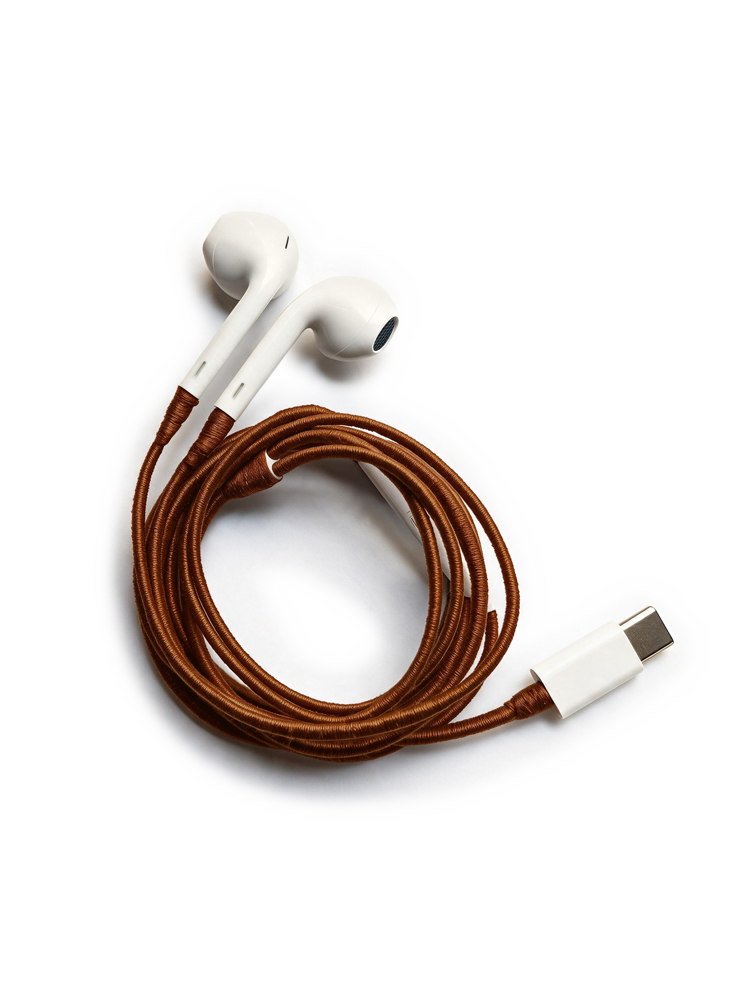 Veronica Beard White earbuds with a coiled brown braided cord and USB-C connector.