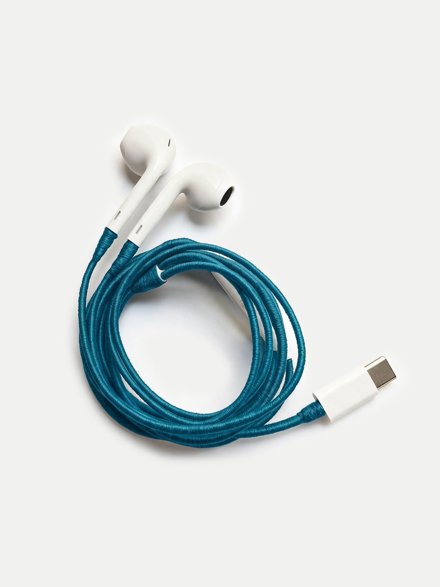 Veronica Beard White earbuds with a teal braided cord and USB-C connector.