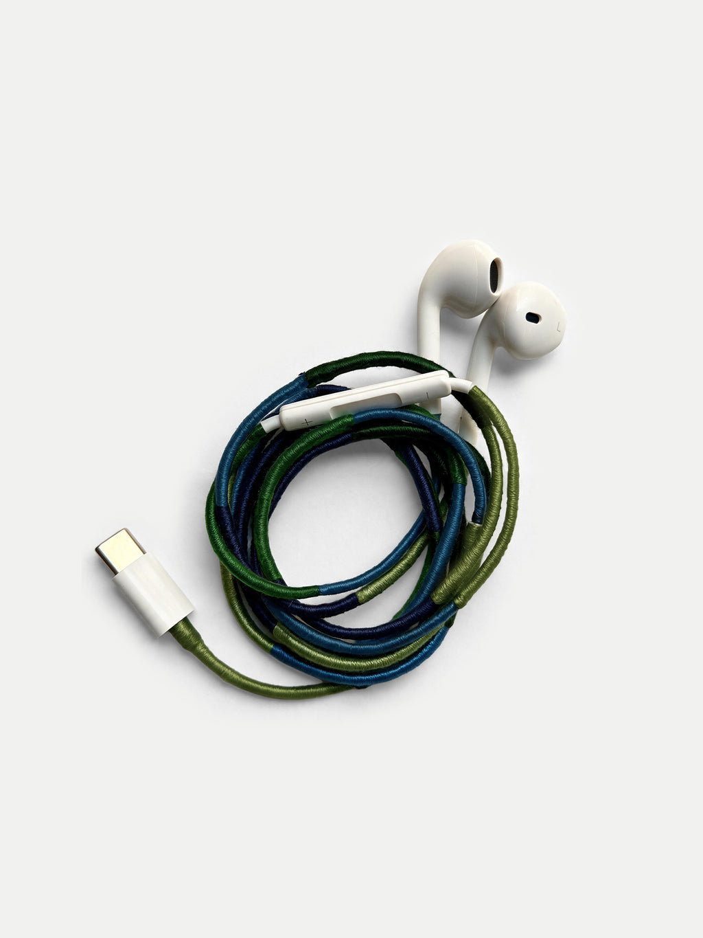 Veronica Beard White earbuds with blue and green braided cord.