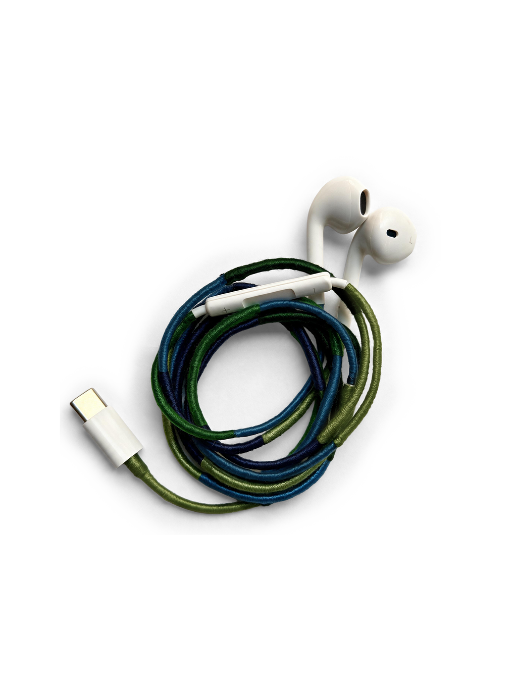 Veronica Beard White earbuds with a braided blue and green cord.