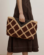 Veronica Beard Brown and tan woven straw clutch with a geometric pattern and dark brown triangular handles.