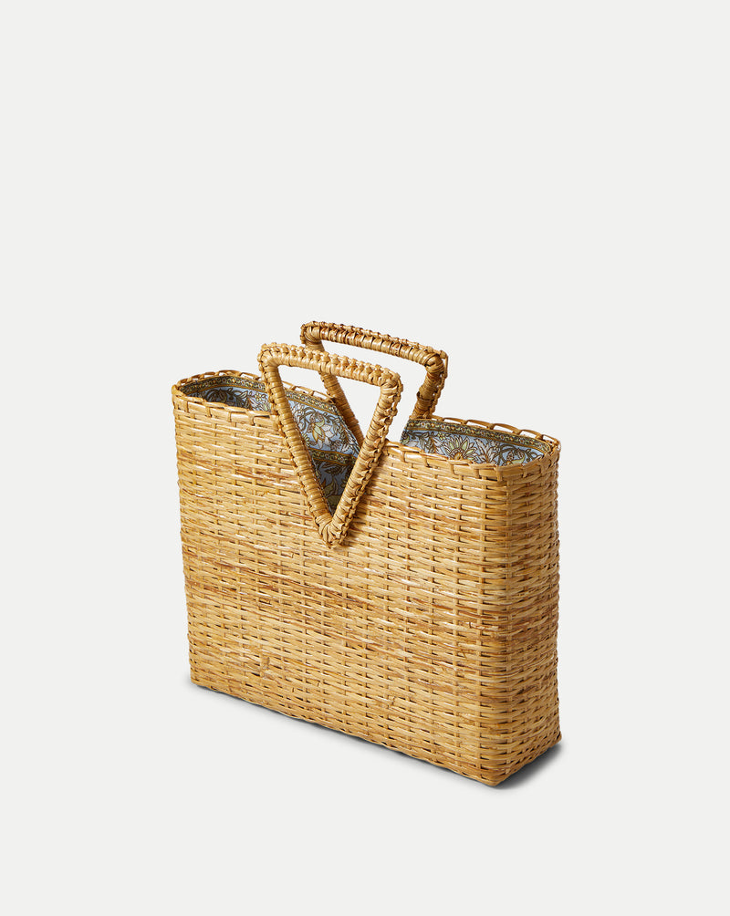 Veronica Beard Woven straw tote bag with triangular handles and a patterned fabric lining.