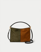 Veronica Beard Green and brown suede shoulder bag with braided handle.