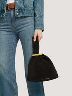 Veronica Beard Black suede knot bag with gold ring handle.