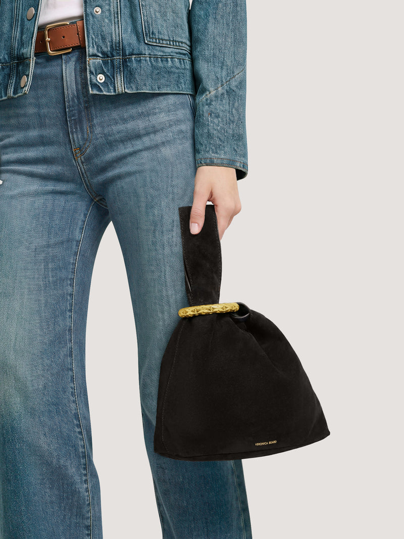 Veronica Beard Black suede knot bag with gold ring handle.