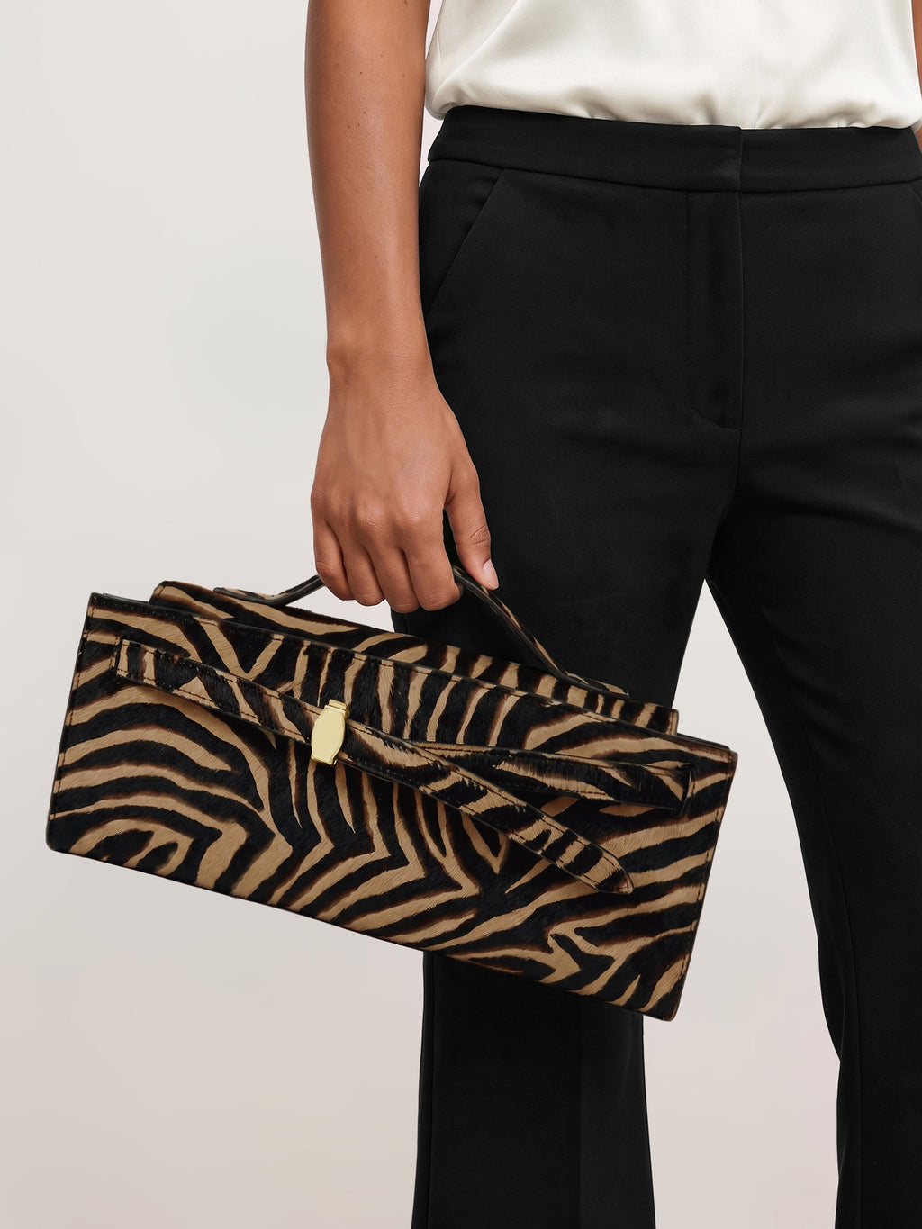Veronica Beard Brown zebra-print calf hair structured top-handle bag.