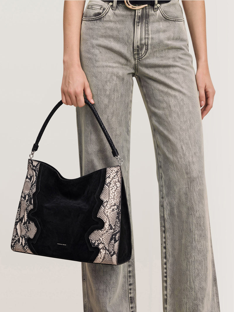 Veronica Beard Black suede and snakeskin hobo bag with braided strap.