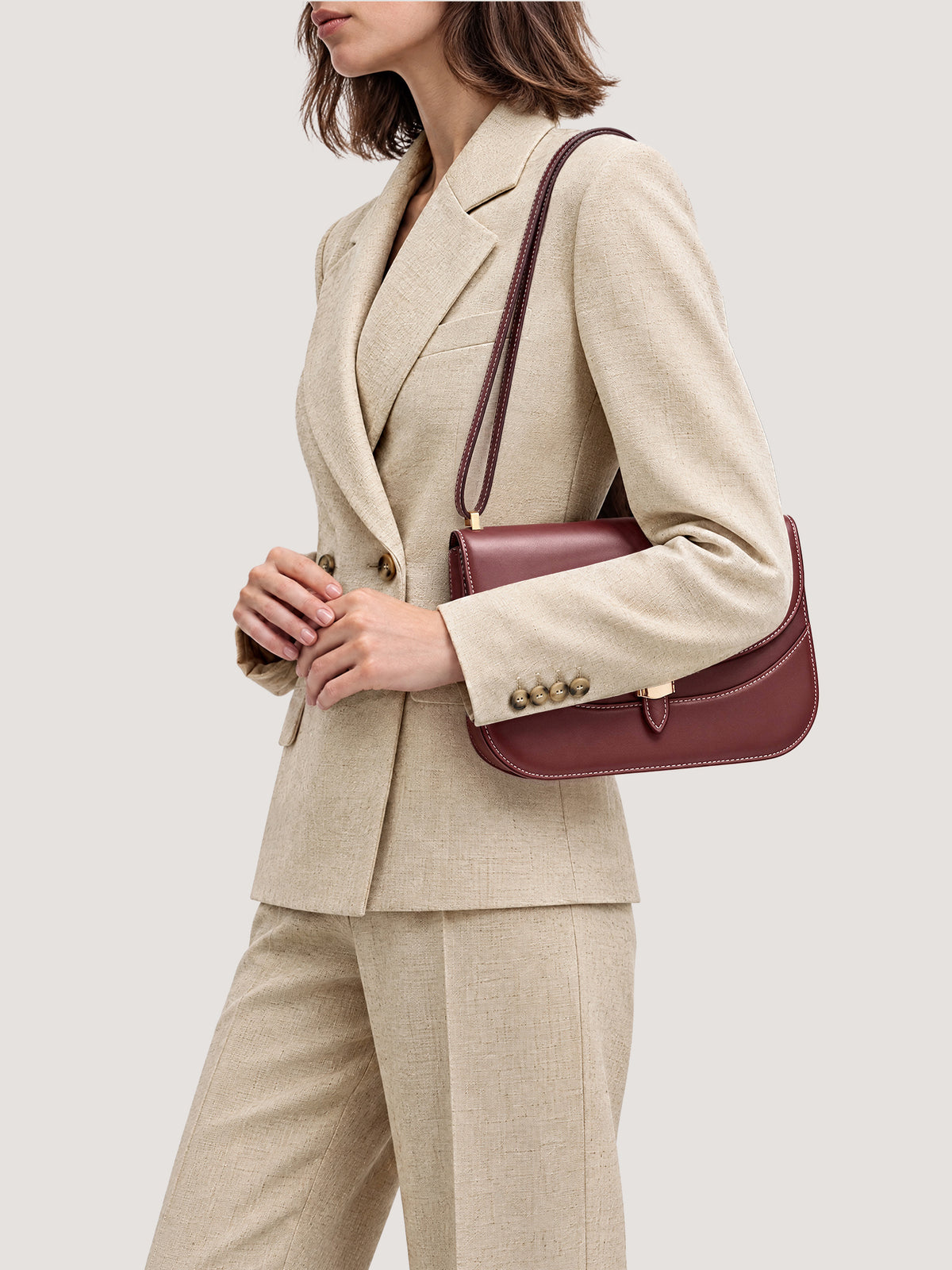 Veronica Beard Beige linen double-breasted blazer and trousers suit.