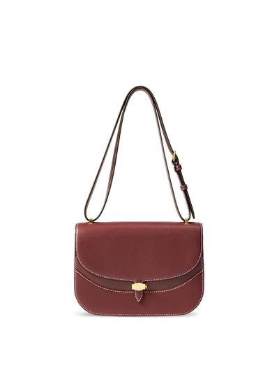 Veronica Beard Burgundy leather structured saddle bag with white stitching.