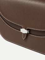 Veronica Beard Brown leather handbag with white stitching and clasp.
