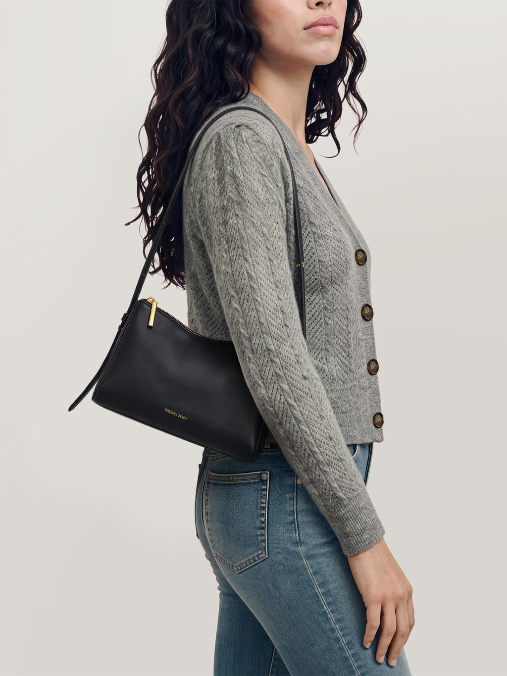 Veronica Beard Black leather shoulder bag with gold zipper.