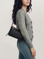 Veronica Beard Black leather shoulder bag with gold zipper.