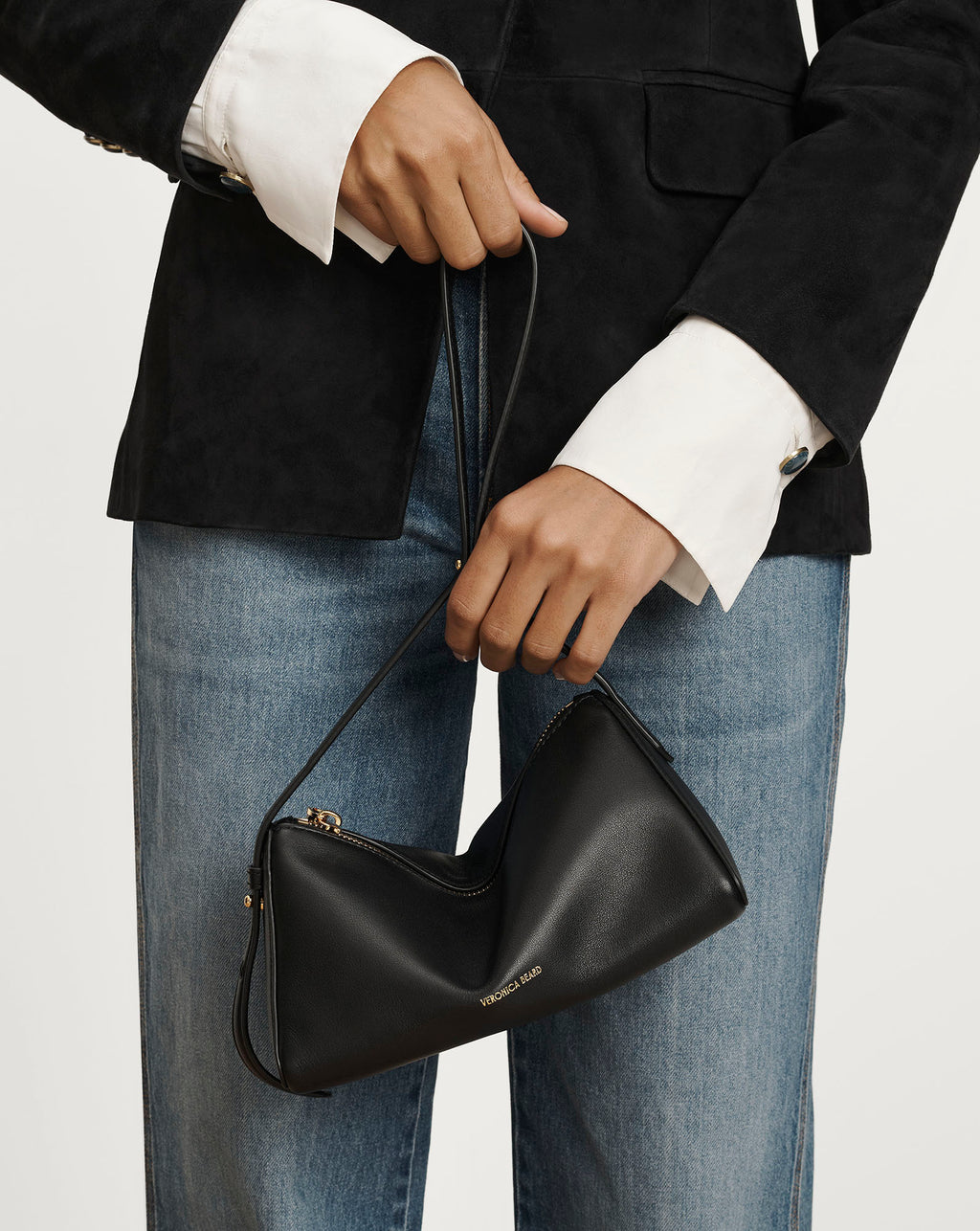 Veronica Beard Black leather handbag with thin strap.