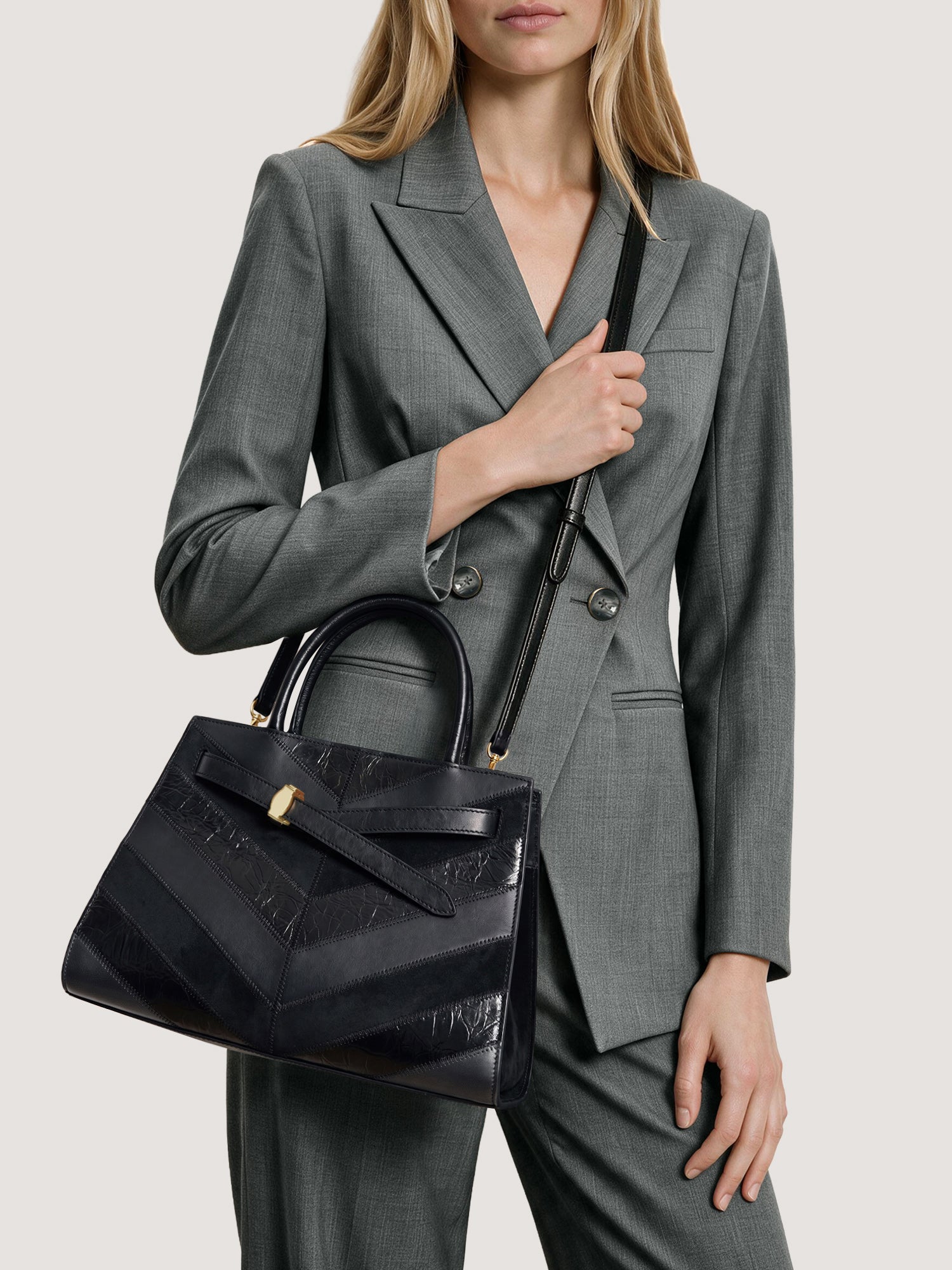 Veronica Beard Black leather structured handbag with chevron patterned panels.