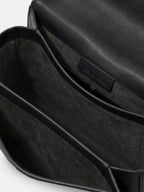 Veronica Beard Black leather shoulder bag interior with suede lining.