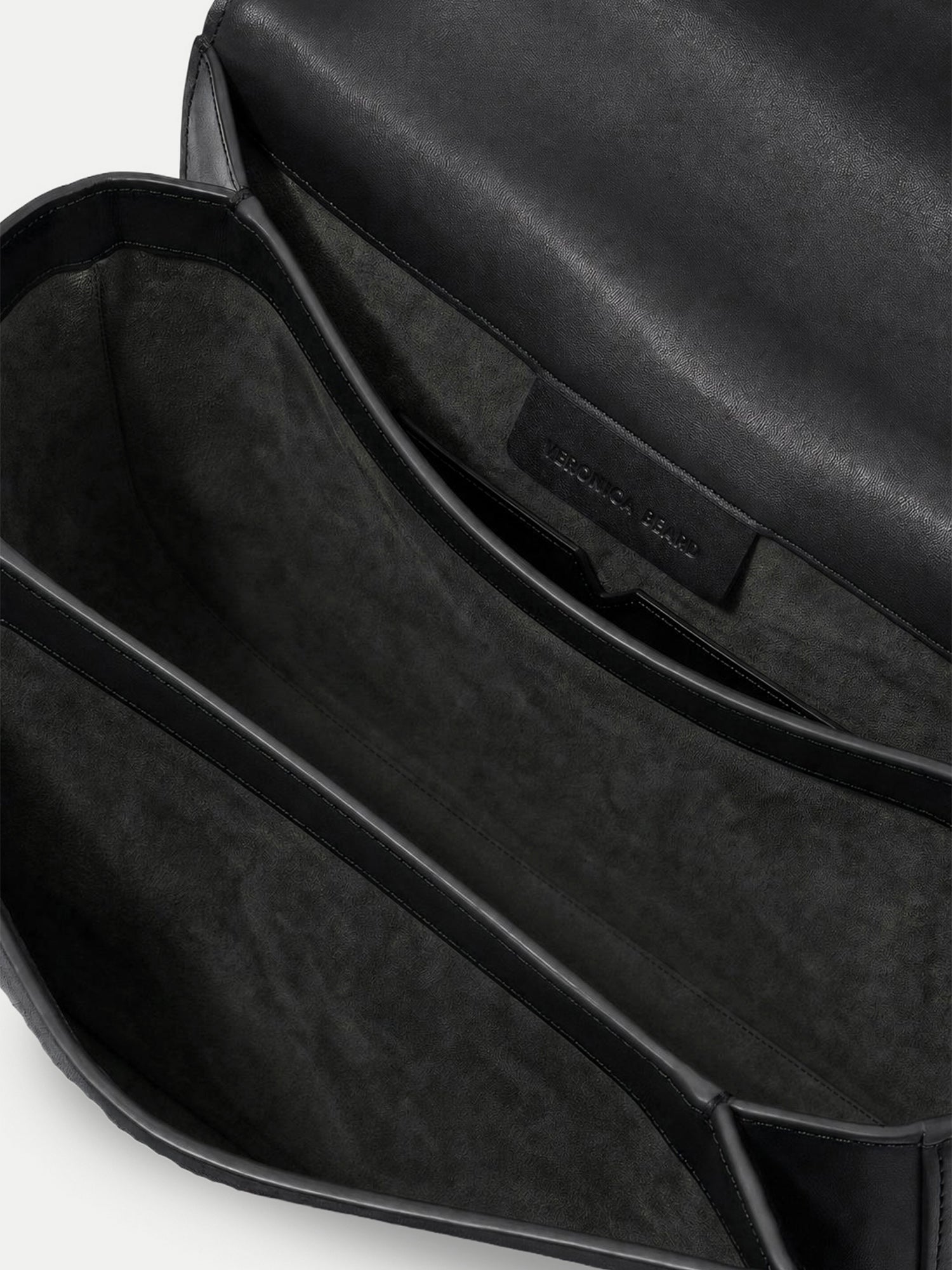 Veronica Beard Black leather shoulder bag interior with suede lining.