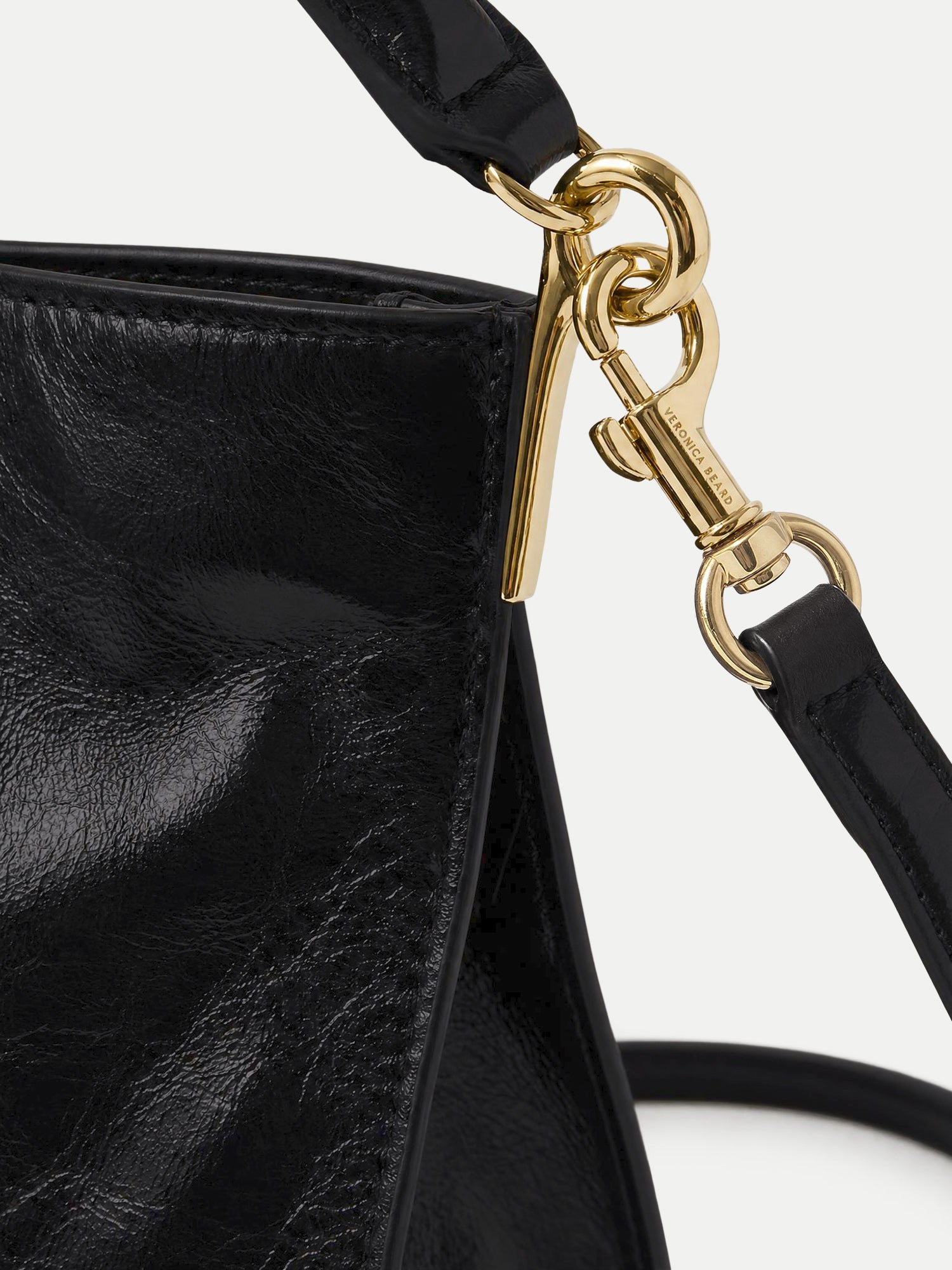 Veronica Beard Black leather handbag with gold hardware.