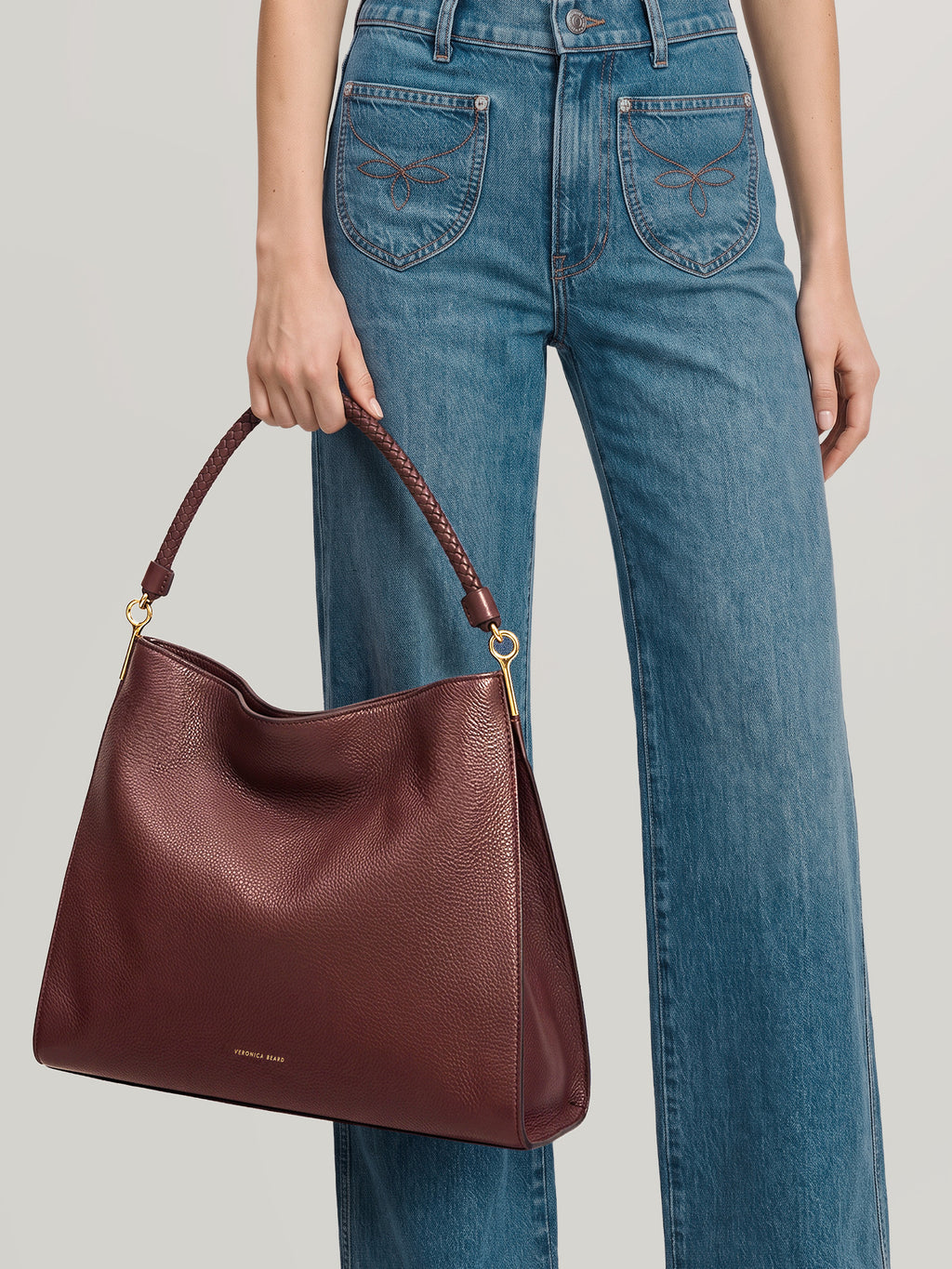 Veronica Beard Burgundy leather slouchy shoulder bag with braided strap.