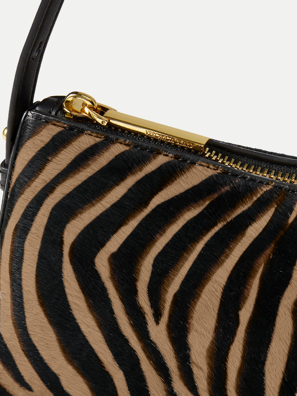 Veronica Beard Zebra print calf hair shoulder bag with gold zipper.