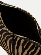 Veronica Beard Zebra print calf hair clutch with gold zipper.