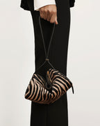 Veronica Beard Brown and black zebra print pouch handbag.