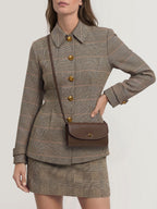 Veronica Beard Brown leather shoulder bag with gold clasp.