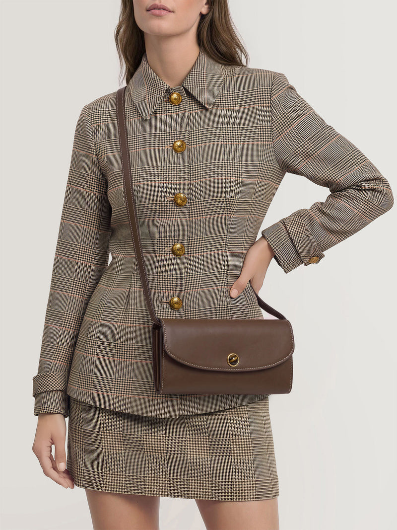 Veronica Beard Brown leather shoulder bag with gold clasp.