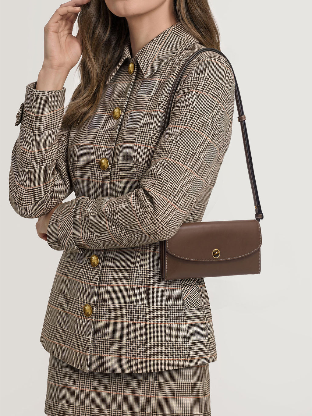 Veronica Beard Brown leather shoulder bag with gold clasp.