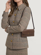 Veronica Beard Brown leather shoulder bag with gold clasp.