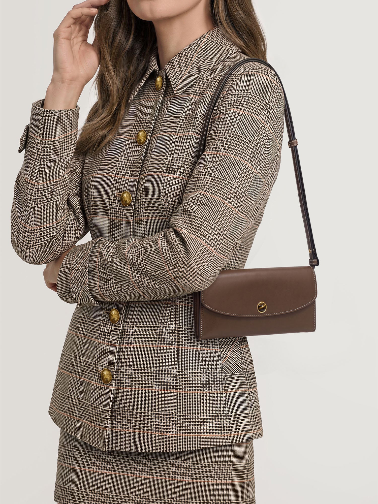 Veronica Beard Brown leather shoulder bag with gold clasp.