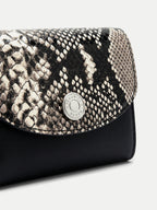 Veronica Beard Black and white snakeskin print wallet with silver button.
