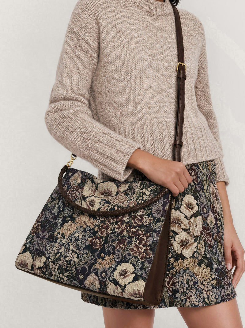 Veronica Beard Floral tapestry crossbody bag with brown leather strap.