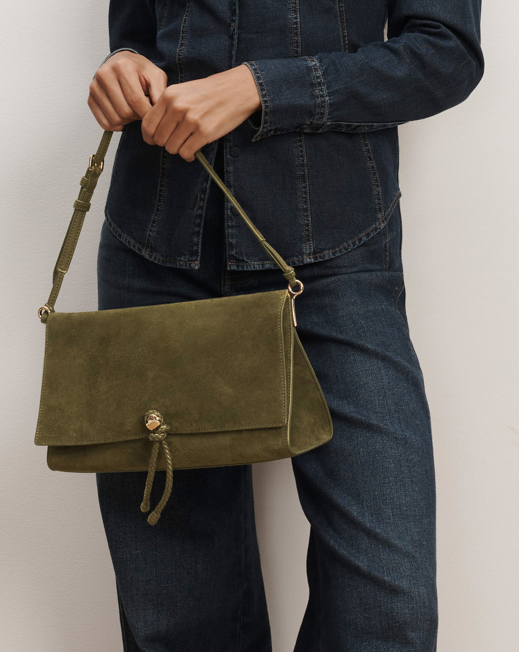 Veronica Beard Olive green suede shoulder bag with drawstring closure.