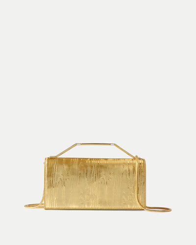 Veronica Beard Structured gold handbag with metallic top handle.