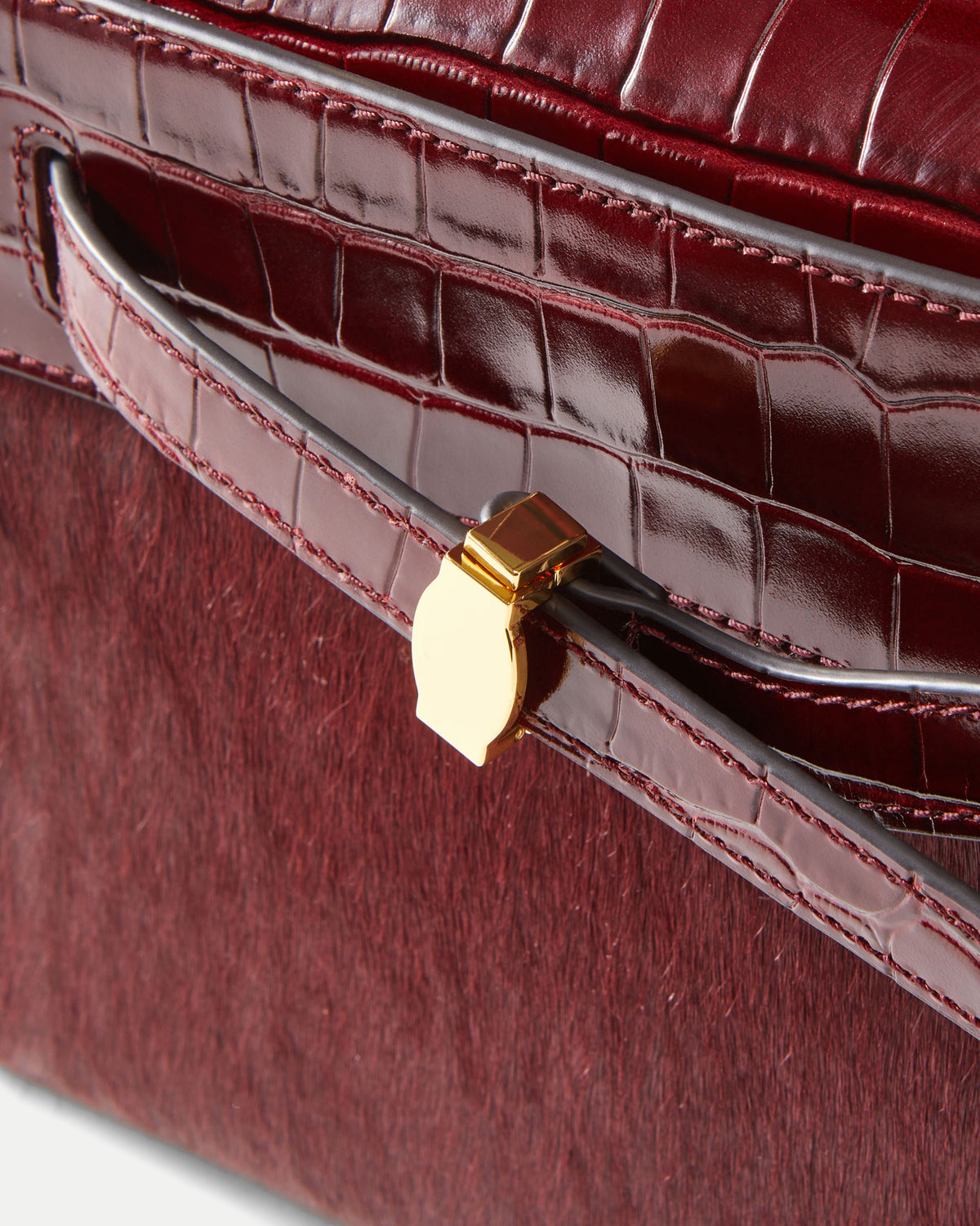 Veronica Beard Burgundy crocodile-embossed leather and calf hair handbag.